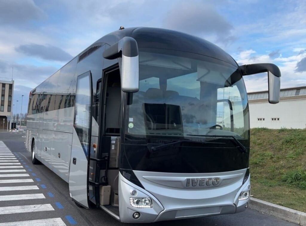 Coach Hire in Heidelberg with luxury coach and group travelers exploring city landmarks with Tour Passion service